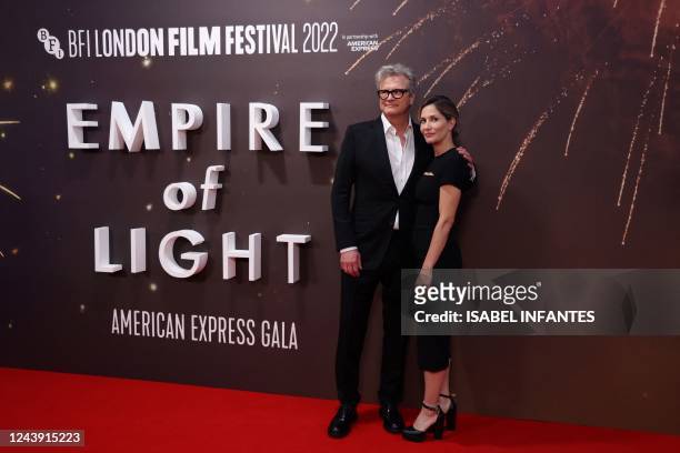 British actor Colin Firth and his wife Livia Giuggioli pose on the red carpet on arrival to attend the American Express Gala European Premiere of...