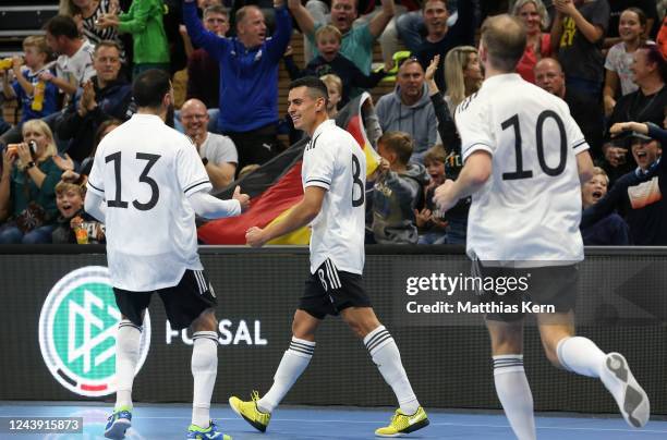 Gabriel Oliveira of Germany celebrates with teammates after scoring his team's first goal during the 2024 Futsal World Cup Qualifier match between...