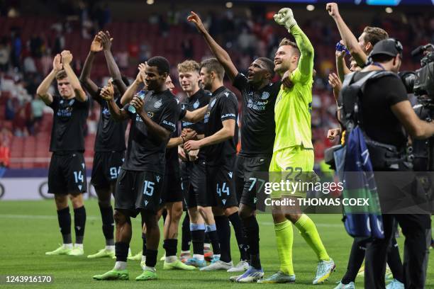 Club Brugge players celebrate at the end of the UEFA Champions League 1st round, group B, football match between Club Atletico de Madrid and Club...