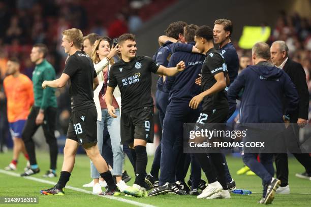 Club Brugge players celebrate at the end of the UEFA Champions League 1st round, group B, football match between Club Atletico de Madrid and Club...