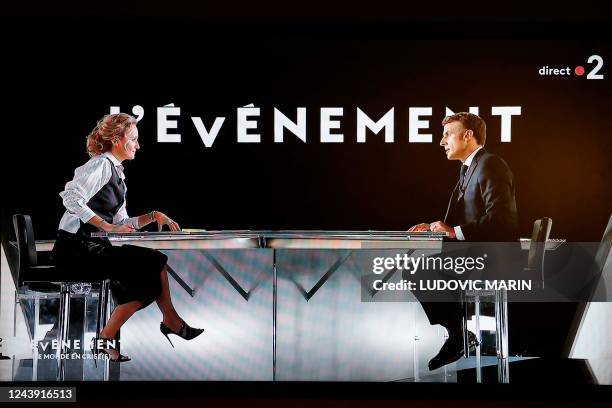 In this screen shot made on Ocober 12, 2022 French president Emmanuel Macron speaks during an interview by French journalist and TV host Caroline...