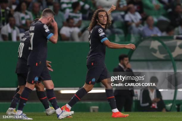 Marseille's French midfielder Matteo Guendouzi celebrates with teammates after scoring his team's first goal during the UEFA Champions League 1st...