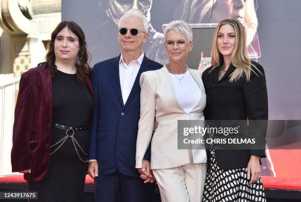 Actress Jamie Lee Curtis stands for a photo with her husband Christopher Guest, and her daughters Ruby and Annie , during her hand and footprint...