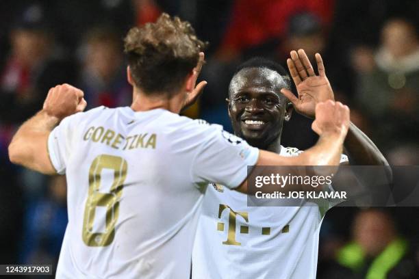 Bayern Munich's German midfielder Leon Goretzka celebrates scoring the 0-3 goal with Bayern Munich's Senegalese forward Sadio Mane during the UEFA...