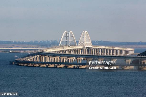 View taken on October 12, 2022 shows the Kerch Bridge that links Crimea to Russia, near Kerch, which was hit by a blast on October 8, 2022. - The...