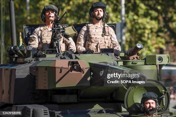 Soldiers in a tank of the Spanish army march during the Hispanic Day parade in Madrid. Spain celebrates its national holiday on October 12, the date...