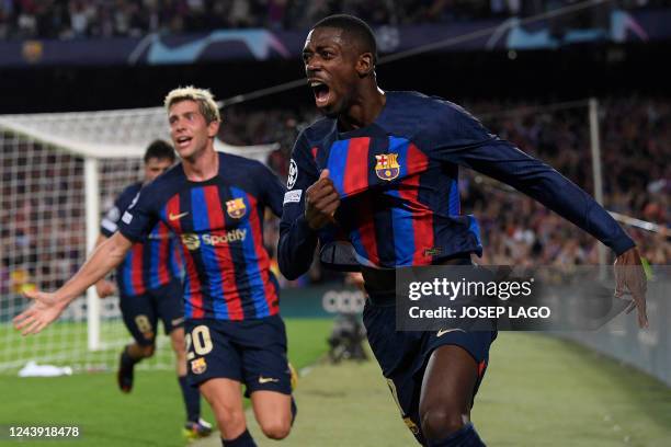 Barcelona's French forward Ousmane Dembele celebrates scoring the opening goal during the UEFA Champions League 1st round, group C, football match...