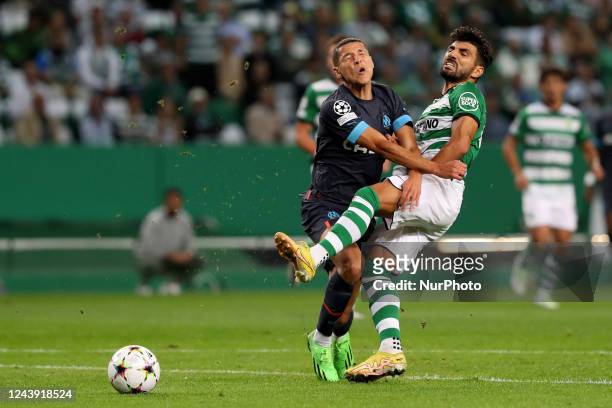 Ricardo Esgaio of Sporting CP makes a fault over Amine Harit of Marseille during the UEFA Champions League Group D football match between Sporting CP...