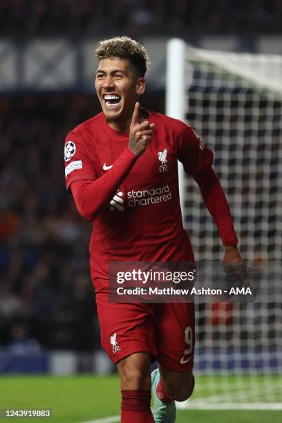 Roberto Firmino of Liverpool celebrates after scoring a goal to make it 1-2 during the UEFA Champions League group A match between Rangers FC and...