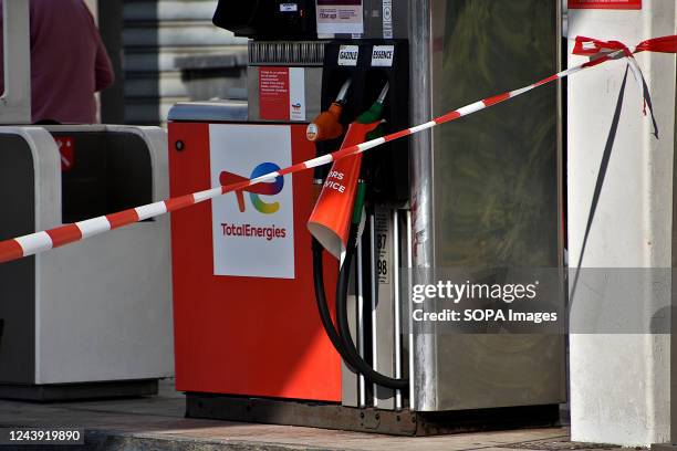 TotalEnergies gas station in Marseille shows signs reading "out of service". A third of French service stations are affected by fuel shortages due to...