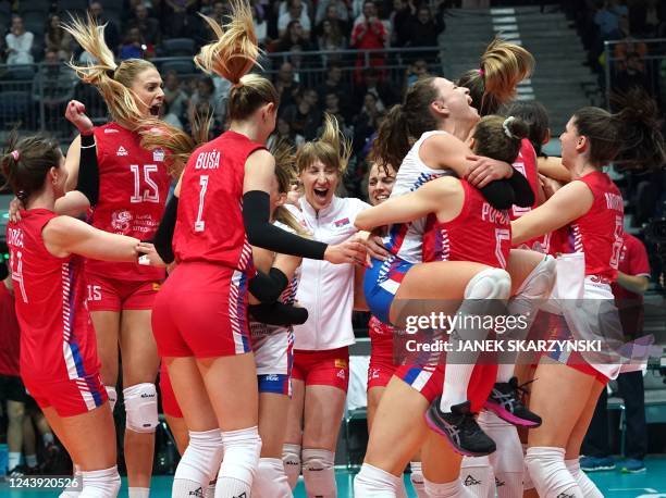 Serbia's players celebrate victory after the Women's Volleyball World Championships semi-final match between Serbia and USA in Gliwice on October 12,...