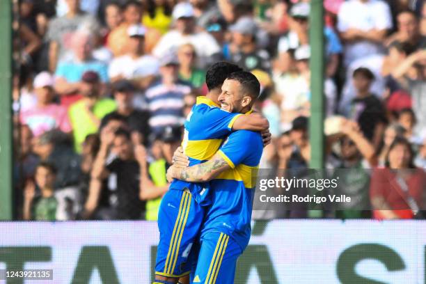Luca Langoni of Boca Juniors celebrates with teammate Dario Benedetto after scoring the first goal of his team during a match between Sarmiento and...