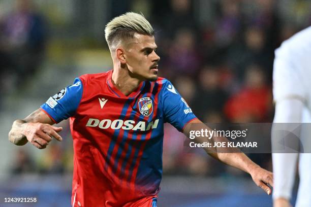 Viktoria Plzen's Czech forward Jan Kliment celebrates scoring the 2-4 goal during the UEFA Champions League Group C football match between FC...