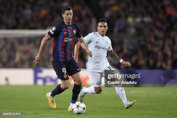 Barcelona's Polish forward Robert Lewandowski vies with Inter Milan forward Lautaro Martinez during the UEFA Champions league football match between...