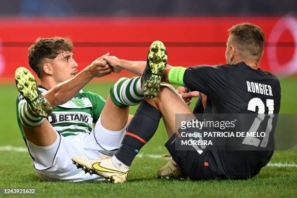 Sporting Lisbon's Spanish defender Jose Martinez Marsa and 21 sit on the pitch during the UEFA Champions League 1st round, group D, football match...