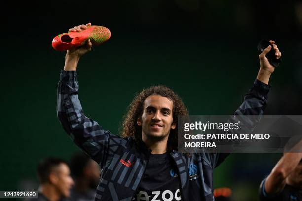 Marseille's French midfielder Matteo Guendouzi celebrates at the end of the UEFA Champions League 1st round, group D, football match between Sporting...