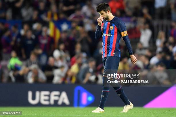 Barcelona's Spanish defender Gerard Pique reacts at the end of the UEFA Champions League 1st round, group C, football match between FC Barcelona and...