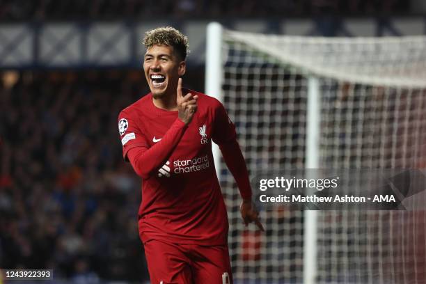 Roberto Firmino of Liverpool celebrates after scoring a goal to make it 1-2 during the UEFA Champions League group A match between Rangers FC and...