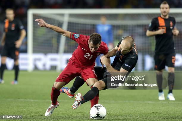 Arjen Robben of Holland, Joao Pereira of Portugal during the EURO match between Portugal v Holland on June 17, 2012