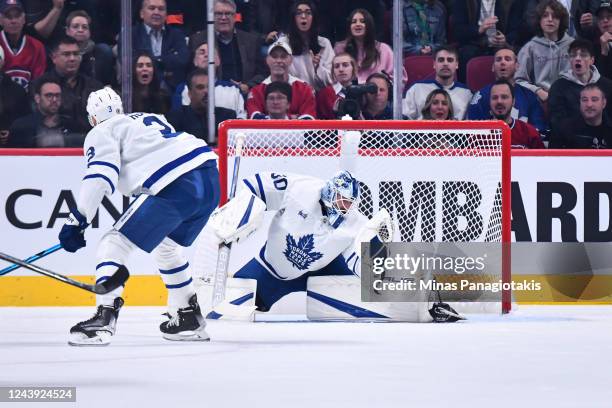 Goaltender Matt Murray of the Toronto Maple Leafs makes a glove save during the first period against the Montreal Canadiens at Centre Bell on October...