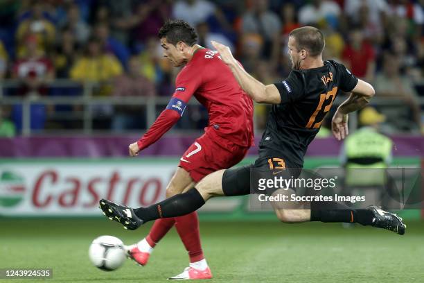 Ron Vlaar of Holland, Cristiano Ronaldo of Portugal scores the second goal to make it 1-1 during the EURO match between Portugal v Holland on June...