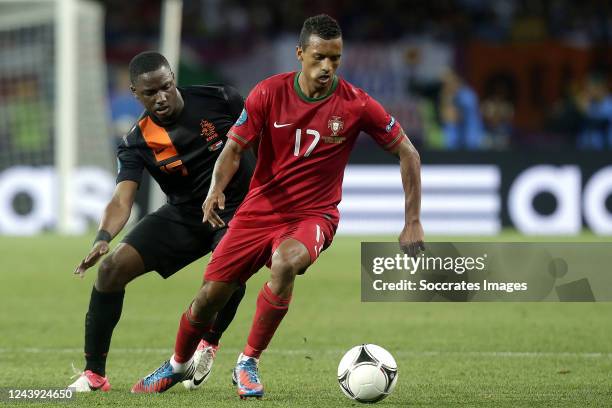 Jetro Willems of Holland, Nani of Portugal during the EURO match between Portugal v Holland on June 17, 2012