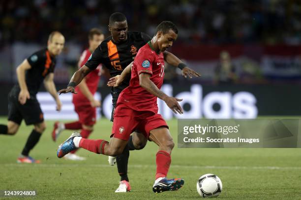 Jetro Willems of Holland, Nani of Portugal during the EURO match between Portugal v Holland on June 17, 2012