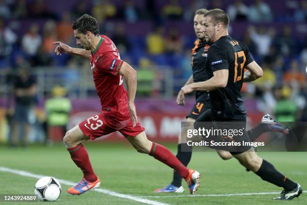 Helder Postiga of Portugal, Ron Vlaar of Holland during the EURO match between Portugal v Holland on June 17, 2012