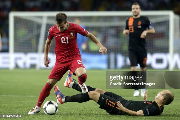 Arjen Robben of Holland, Joao Pereira of Portugal during the EURO match between Portugal v Holland on June 17, 2012