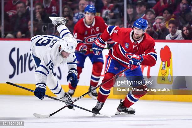 Chris Wideman of the Montreal Canadiens takes down Calle Jarnkrok of the Toronto Maple Leafs during the first period at Centre Bell on October 12,...