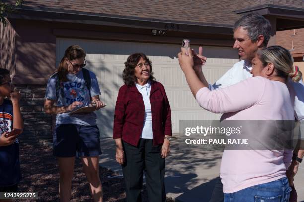 Texas Democratic gubernatorial candidate Beto O'Rourke and his wife Amy Hoover Sanders speak with supporters while canvassing for O'Rourke's campaign...