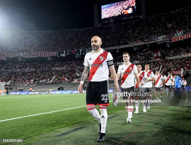 Javier Pinola of River Plate leads his teammates into the pitch before a match between River Plate and Platense as part of Liga Profesional 2022 at...