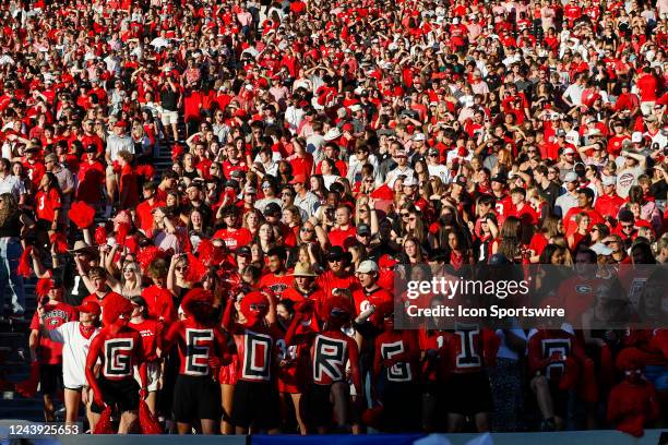 Students cheer during a college football game between the Auburn Tigers and the Georgia Bulldogs on October 8, 2022 at Sanford Stadium in Athens, GA.