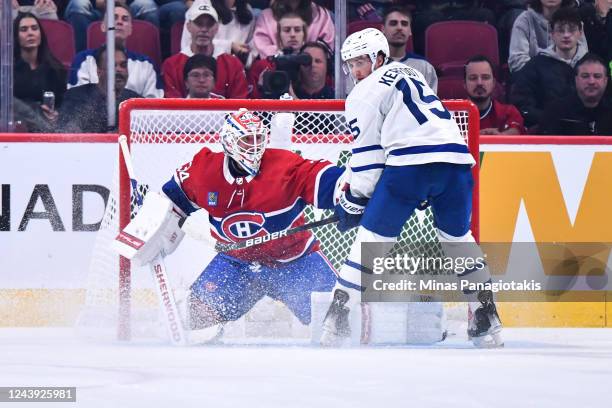 Goaltender Jake Allen of the Montreal Canadiens defends against Alexander Kerfoot of the Toronto Maple Leafs during the second period at Centre Bell...