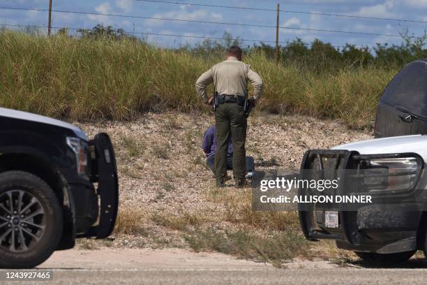 Webb County Sheriffs Officer and US Border Patrol arrest a man smuggling migrants in a vehicle on October 12, 2022 in Laredo, Texas.