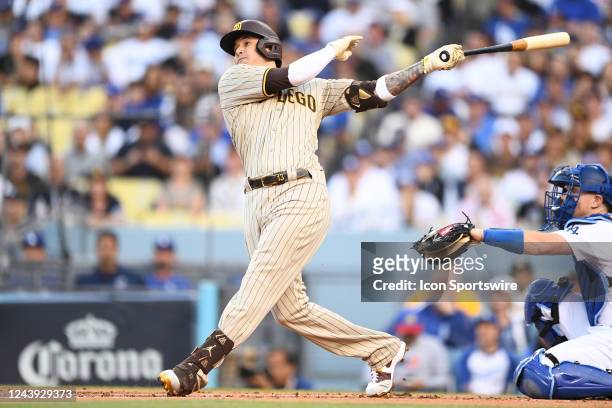 San Diego Padres third baseman Manny Machado hits a home run during the NLDS Game 2 between the San Diego Padres and the Los Angeles Dodgers on...