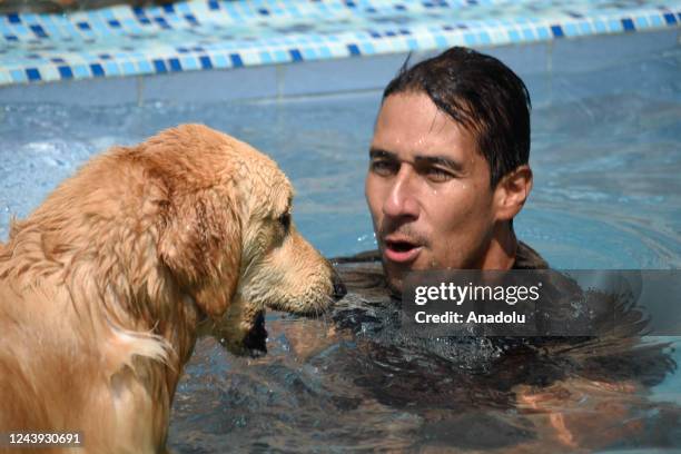 David and Max spending time in the pool at their house on hot afternoons in Cali.With a helmet, glasses, and jacket. Max walks the streets of Cali...