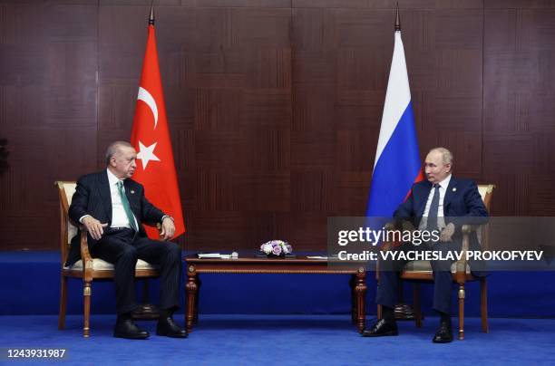Russian President Vladimir Putin meets with Turkey's President Recep Tayyip Erdogan on the sidelines of the Sixth Summit of the Conference on...