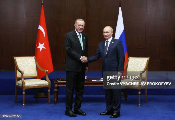 Russian President Vladimir Putin meets with Turkey's President Recep Tayyip Erdogan on the sidelines of the Sixth Summit of the Conference on...