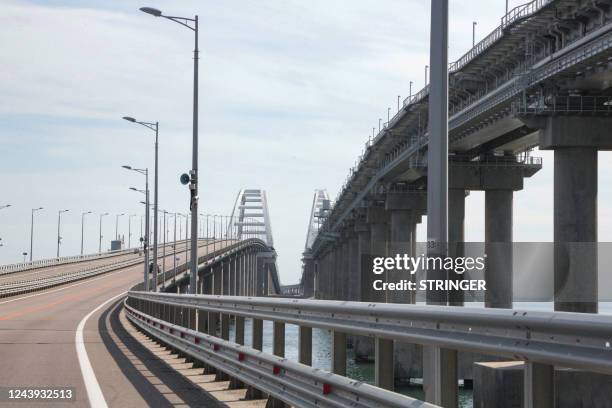 This picture taken on October 13, 2022 shows the Kerch Bridge that links Crimea to Russia, which was hit by a blast on October 8, 2022. - The...