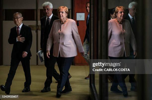 Germany's former chancellor Angela Merkel arrives for a press conference during a ceremony of the Gulbenkian Prize for Humanity, at the Calouste...