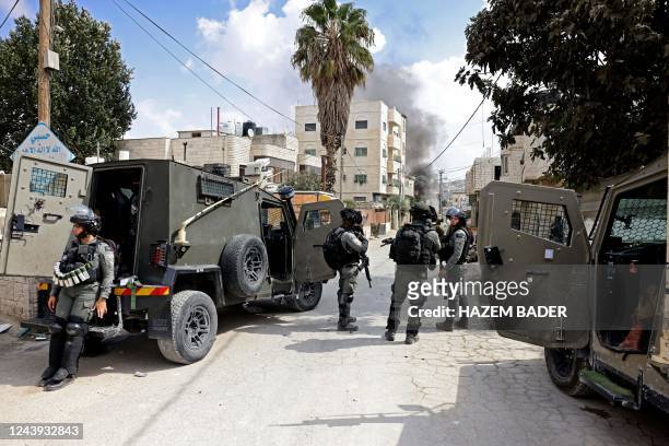 Graphic content / Israeli security forces on October 13 take position at the entrance of al-Aroub refugee camp near the occupied West Bank city of...