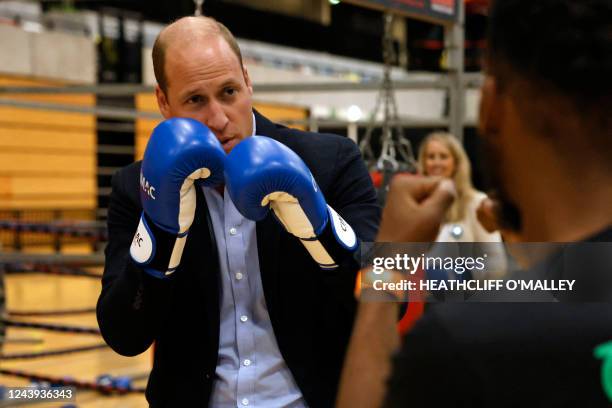 Britain's William , Prince of Wales, trains in boxing gloves during a visit to Copper Box Arena to celebrate the 10th anniversary of Coach Core in...