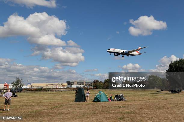 British Airways Boeing 787 Dreamliner aircraft as seen on final approach flying over the houses of Myrtle avenue in London a famous location for...