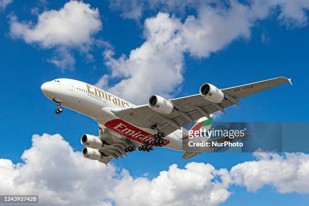 Emirates Airbus A380 aircraft as seen flying for landing at London Heathrow Airport LHR as it is arriving from Dubai UAE DXB. The wide body double...