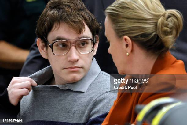 Marjory Stoneman Douglas High School shooter Nikolas Cruz tugs at his shirt collar as he is seated at the defense table for the verdict in his trial...