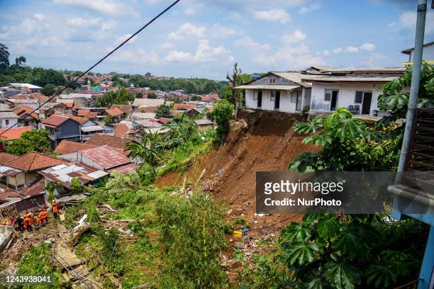 Indonesian Rescuer search for victims of landslides that swept away homes due heavy rainfall at a village in Bogor City, West Java, Indonesia on...