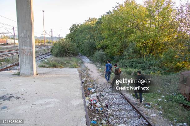 Asylum seekers as seen at Idomeni railway station, a few meters before the borderline between Greece and Northern Macedonia as seen resting and...
