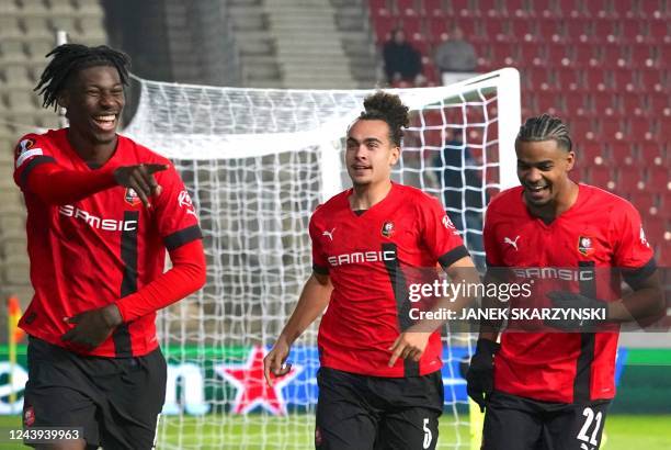 Rennes' Cameroonian defender Christopher Wooh celebrates after scoring a goal with teammates Rennes' Belgian defender Arthur Theate and Rennes'...