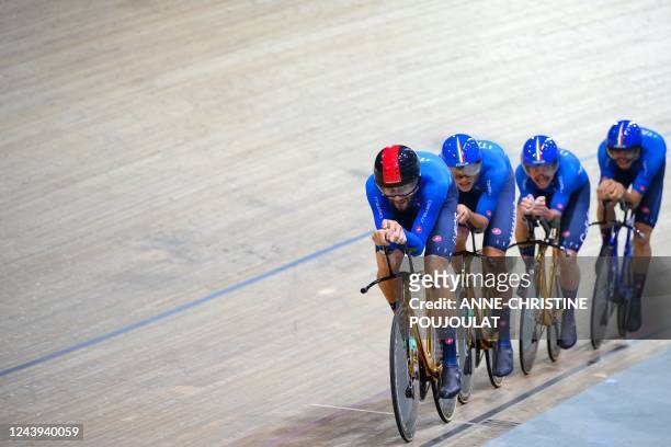 Italy's Filippo Ganna leads his team as they compete in the Men's Team Pursuit finals during the UCI Track Cycling World Championships at the...